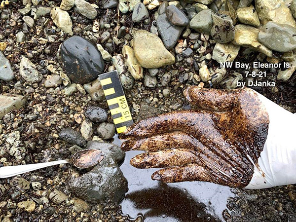 oily residue on gloved hand